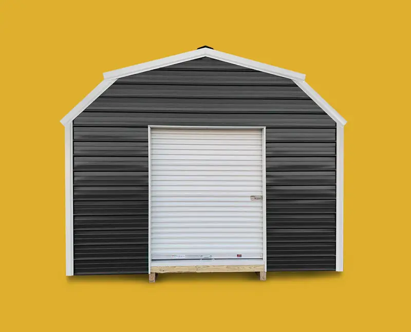Black metal barn style building with white trim