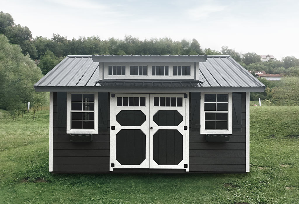 Black garden shed with white trim